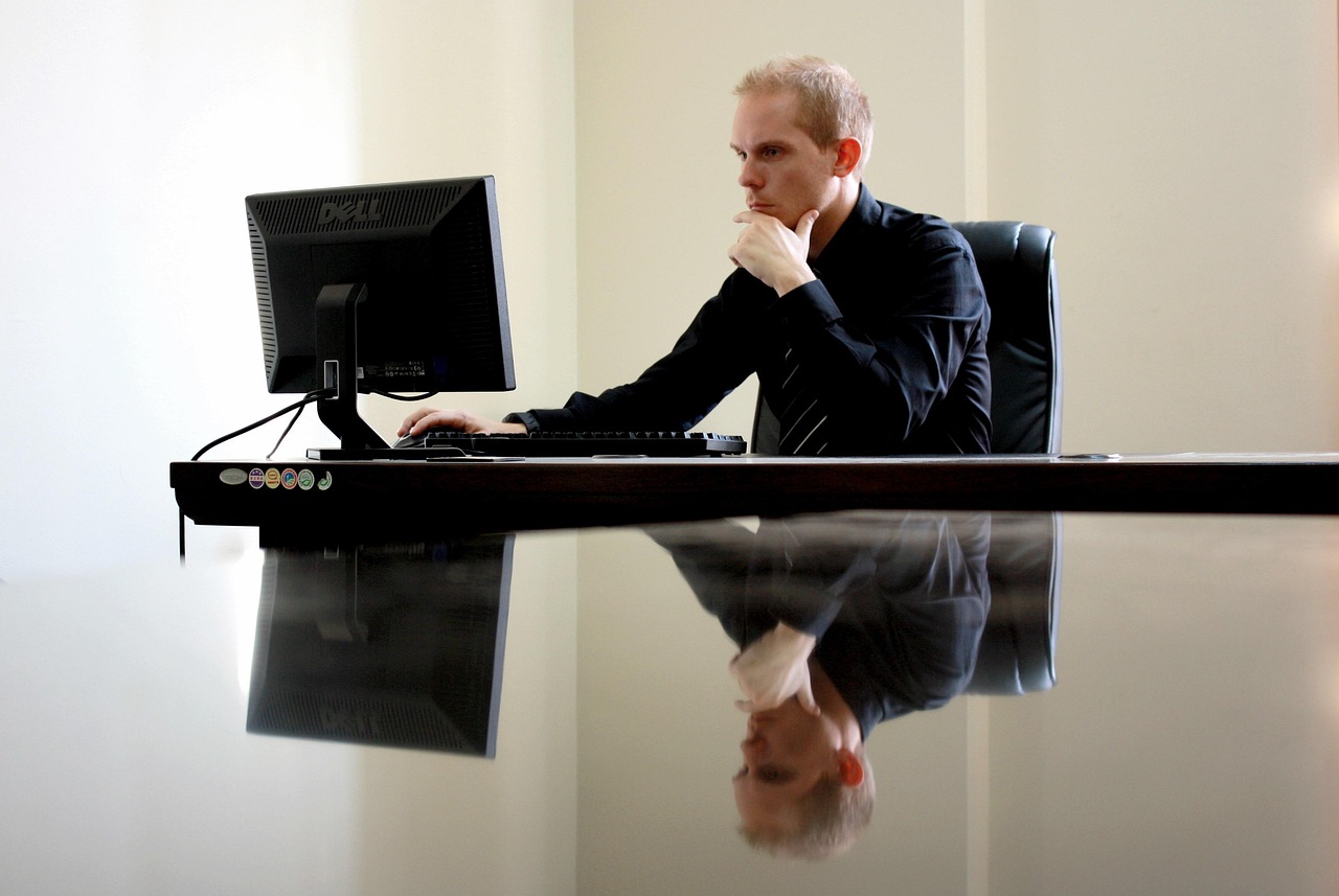 Editorial photo for Can I Sue My Employer for Unfair Treatment, showing employment records and workplace documents.
