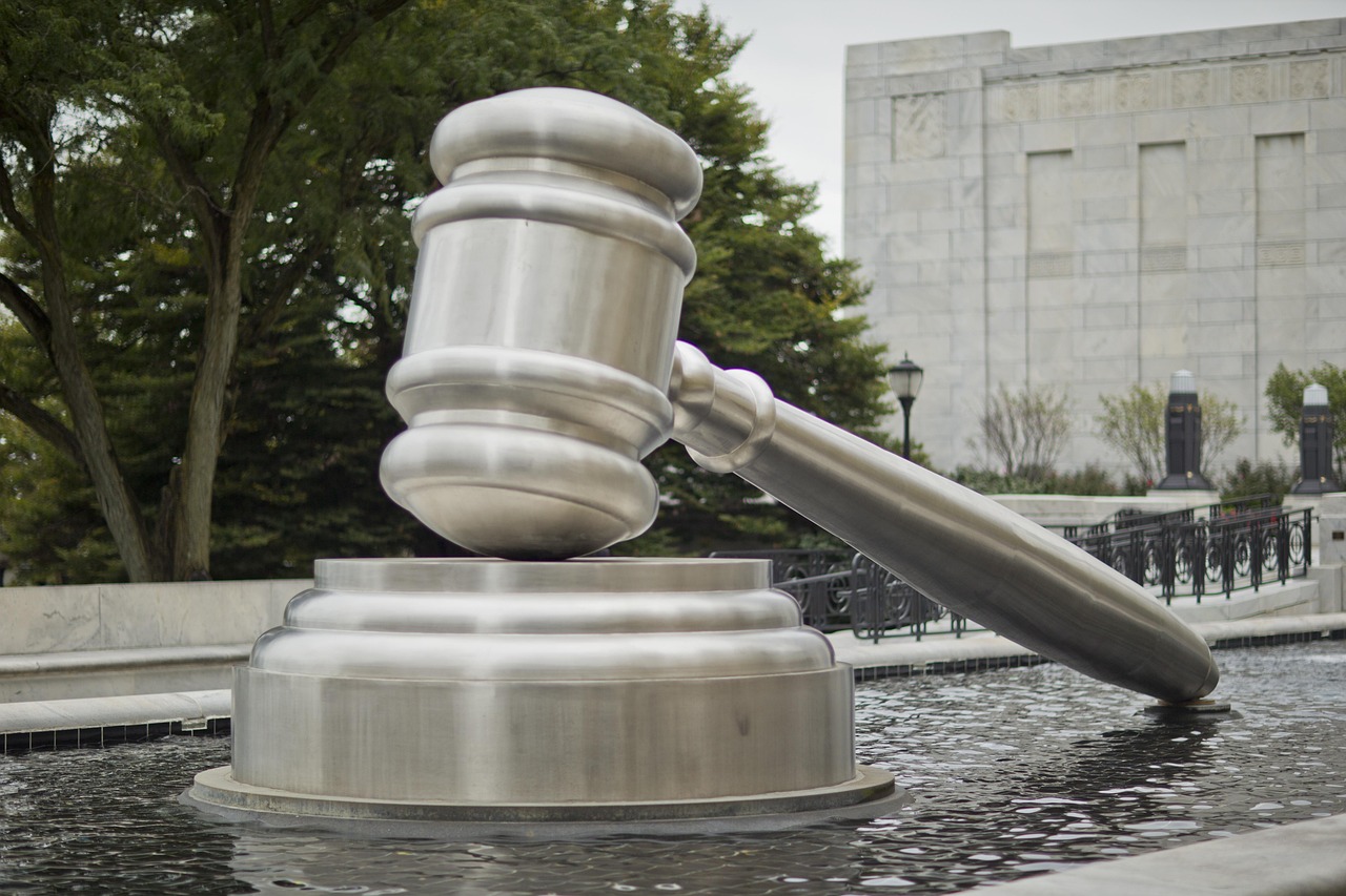 Editorial photo for Breach Of Non-Disclosure Agreement In Entertainment Industry: Protecting Script And Concept Confidentiality, showing legal research and consultation documents.