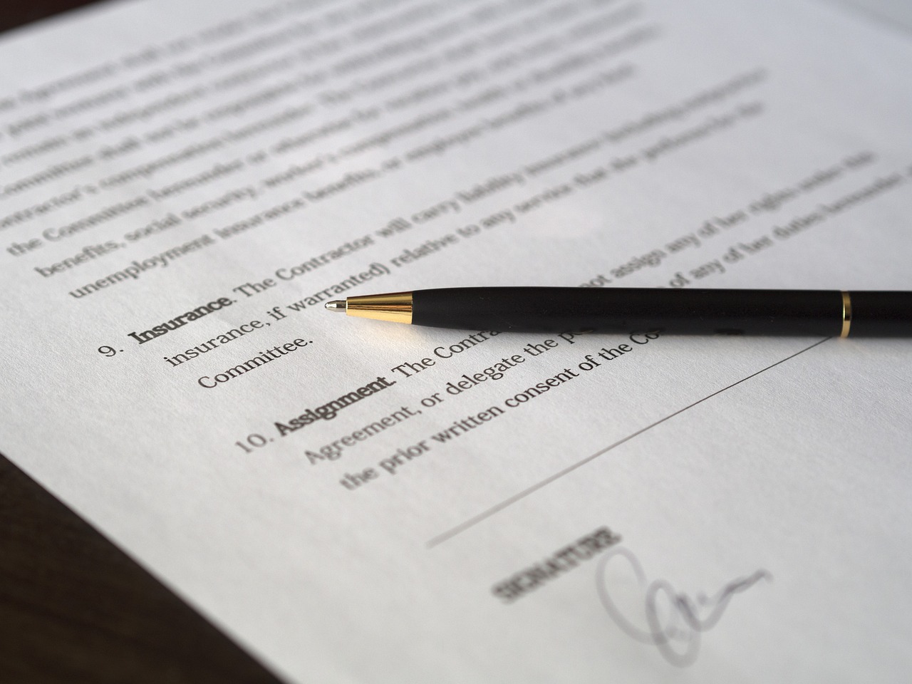 Editorial photo for Discrimination In Restaurant Services: Seeking Redress For Unequal Treatment, showing business contracts, invoices, and settlement paperwork.